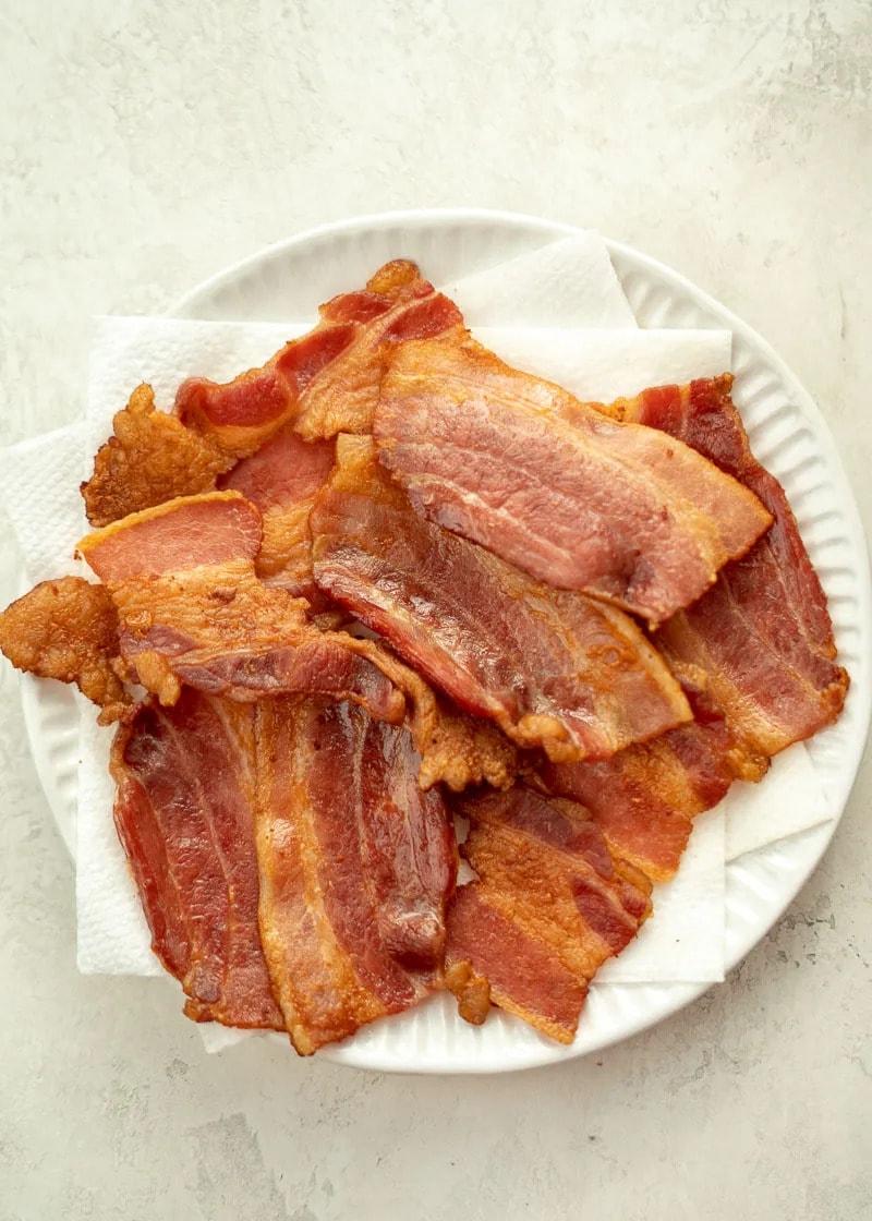 This easy Air Fryer Bacon is quick and prevents splatters in the kitchen! Perfect addition to breakfast, wraps, salads, and more!