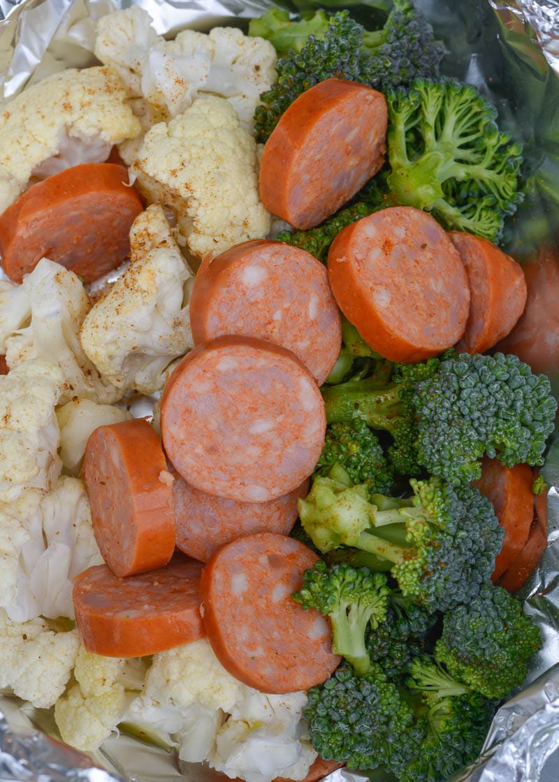 This easy weeknight meal is packed with flavor. The spicy Cajun seasoning of the andouille sausage is complimented perfectly by the Old Bay. By putting everything into a foil packet, your veggies and meat will be cooked until tender, then sprinkled with cheddar cheese. This low carb recipe comes out to only 6.2 net carbs, making it perfect for your keto diet!