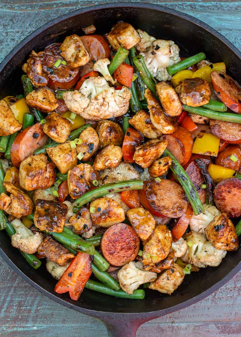 This BBQ Chicken and Smoked Sausage Skillet is the perfect one pan dinner! This meal is loaded with veggies and protein and is about 4 net carbs!