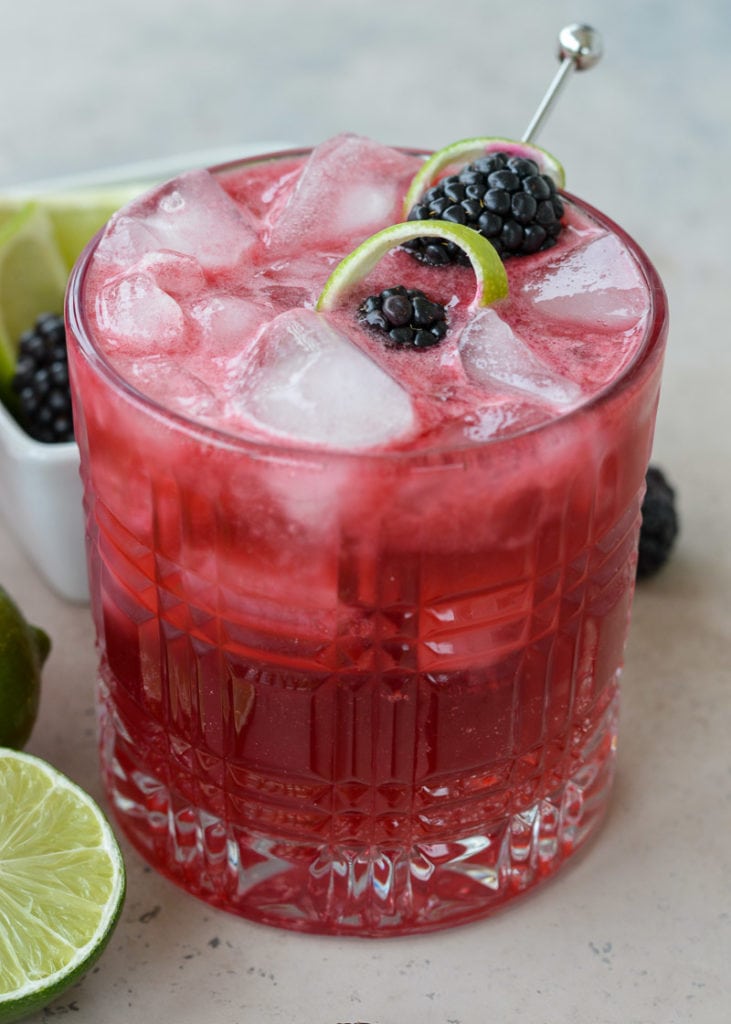 Try a Blackberry Bourbon Smash for a skinny keto cocktail! This beautiful low carb drink is perfect for a summer day and only 2.5 net carbs each!