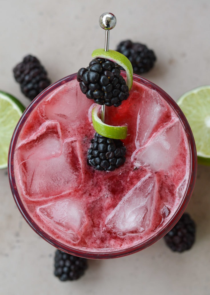 Try a Blackberry Bourbon Smash for a skinny keto cocktail! This beautiful low carb drink is perfect for a summer day and only 2.5 net carbs each!