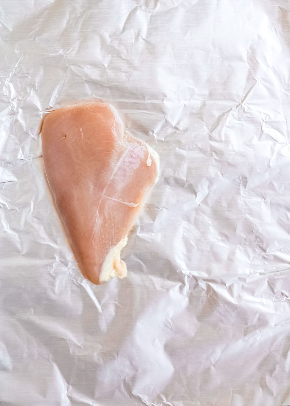 chicken breast on aluminum foil