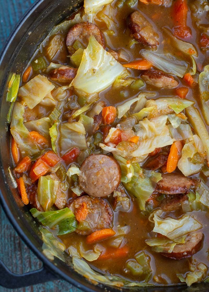 This Cabbage and Sausage Soup is the perfect way to warm up on a chilly night! This soup is rich, comforting and about 5 net carbs a bowl!