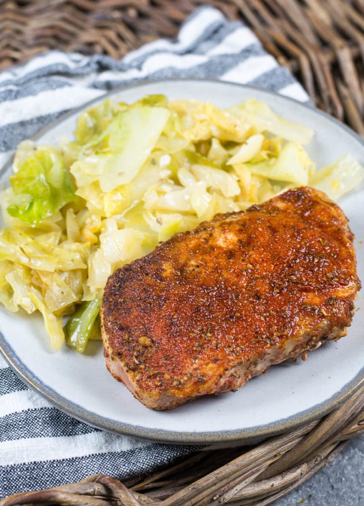 This easy Cajun Pork Chops and Fried Cabbage dish is the easiest one pan, 30 minute meal! At just 3.7 net carbs this is a low carb, keto approved dinner you will love! #keto