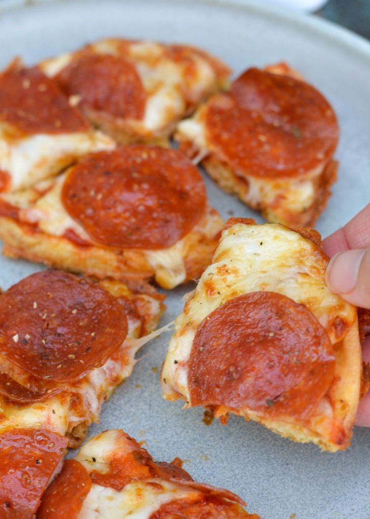 Learn how to make a Pizza Chaffle! This quick and easy keto pizza recipe is perfect for lunches or busy weeknights! Each low carb pizza has just 1.8 net carbs! 