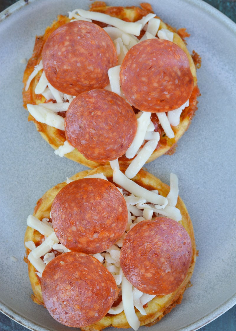 Learn how to make a Pizza Chaffle! This quick and easy keto pizza recipe is perfect for lunches or busy weeknights! Each low carb pizza has just 1.8 net carbs! 