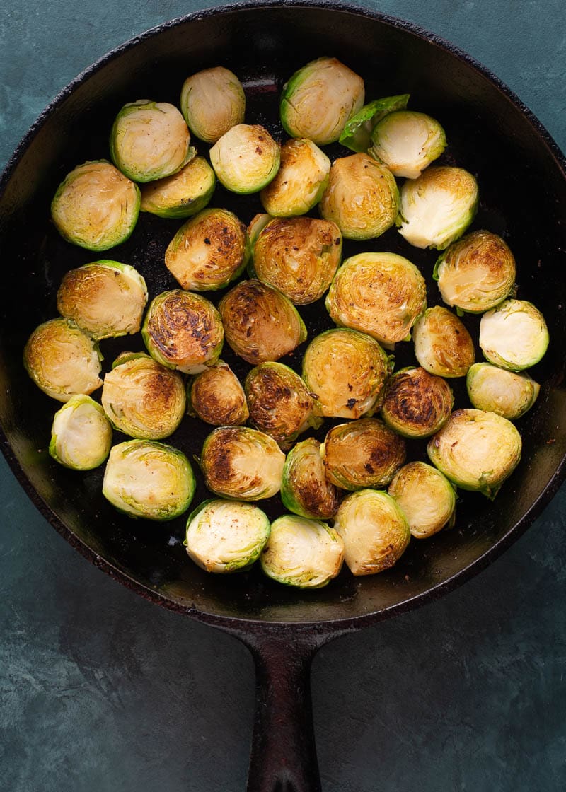 These Cheesy Brussels Sprouts with Bacon are made in one pan and perfect for entertaining! This easy vegetable side dish is low carb and keto-friendly! 