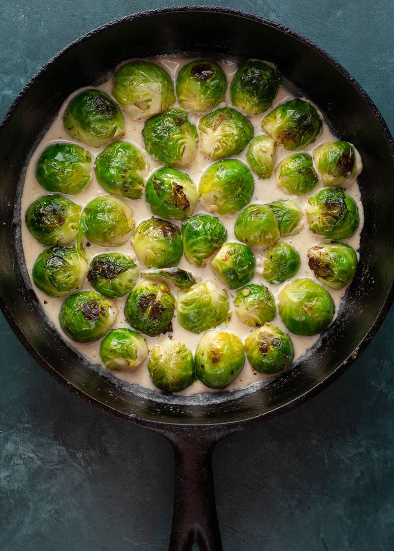 These Cheesy Brussels Sprouts with Bacon are made in one pan and perfect for entertaining! This easy vegetable side dish is low carb and keto-friendly! 