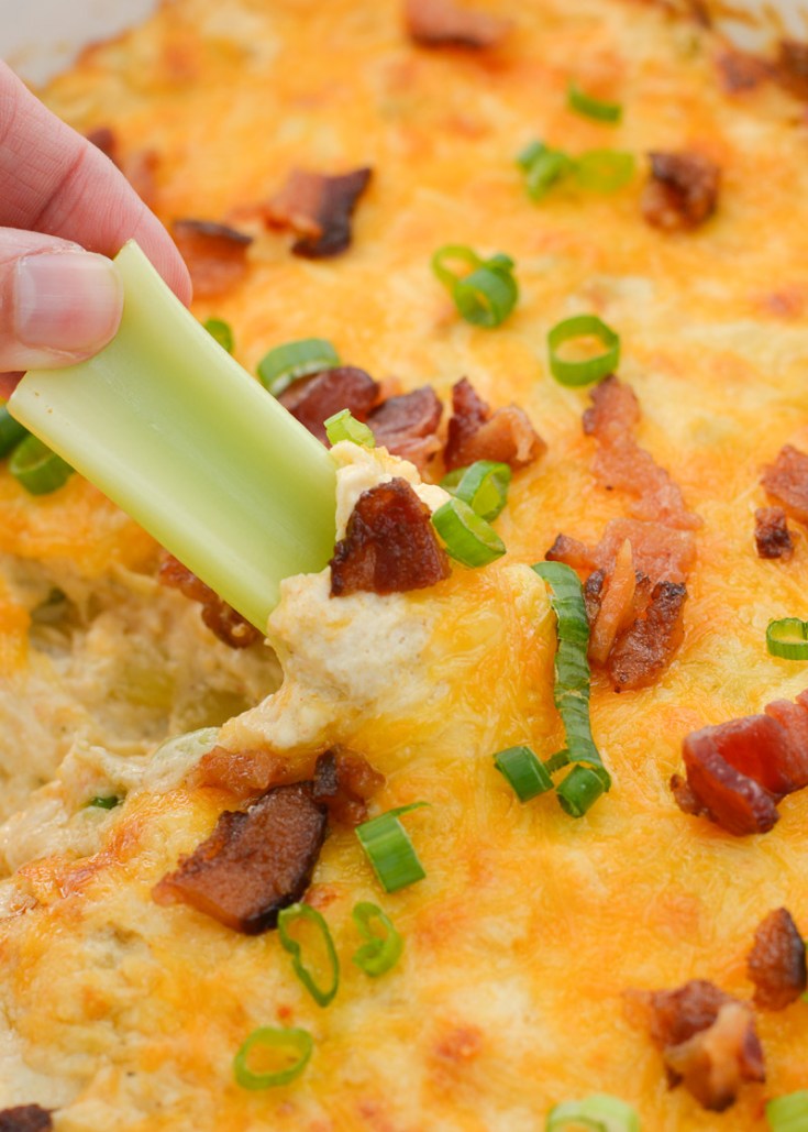 This Cheesy Crab and Bacon Dip is loaded with tender lump crab, crispy bacon, green onions and three kinds of cheese! When paired with crunchy celery sticks this is the perfect low carb game day appetizer! 