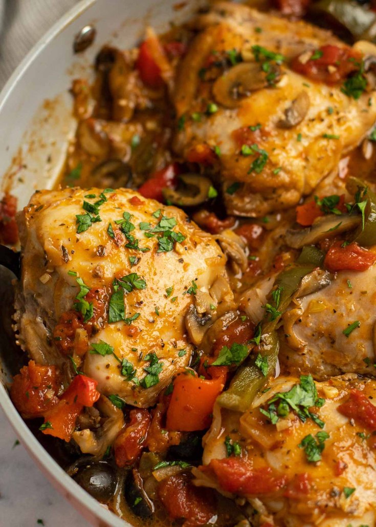 chicken thighs in chicken cacciatore sauce in a skillet