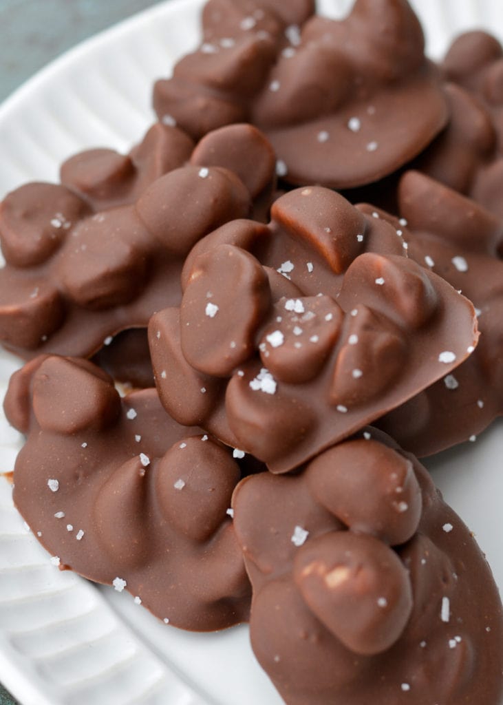 Three ingredient Chocolate Covered Macadamia Nuts are the perfect keto snack! These low carb, sugar free chocolate treats contain just 2 net carbs each!