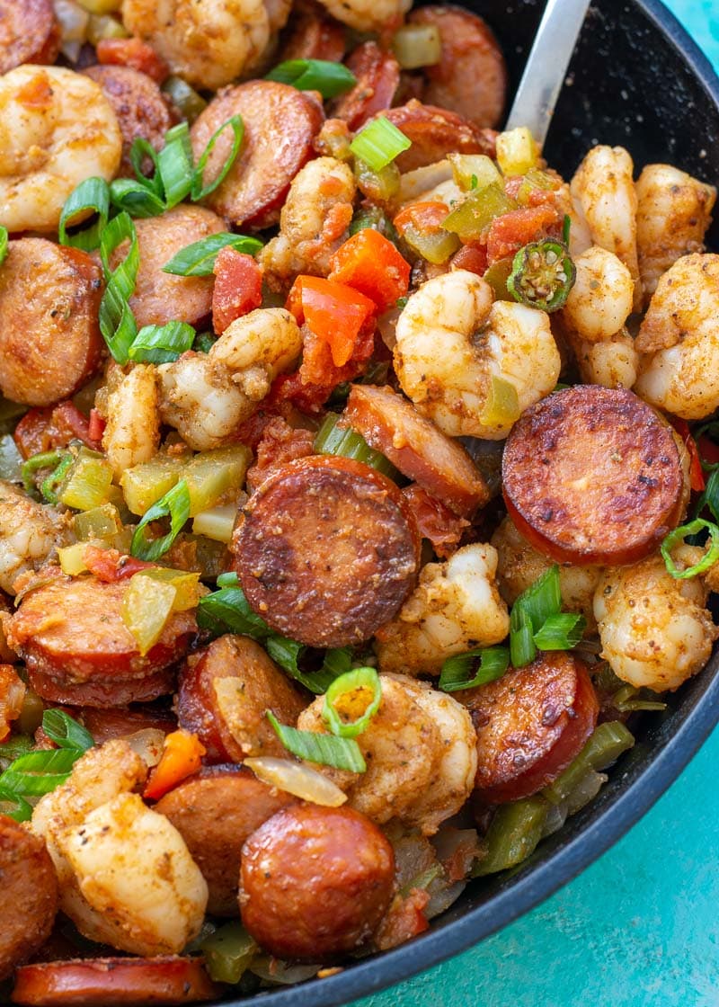 This Creole Shrimp and Sausage Skillet is the perfect 20 minute dinner recipe! This dish is packed with smoked sausage, tender shrimp, and vegetables in a buttery cajun sauce!