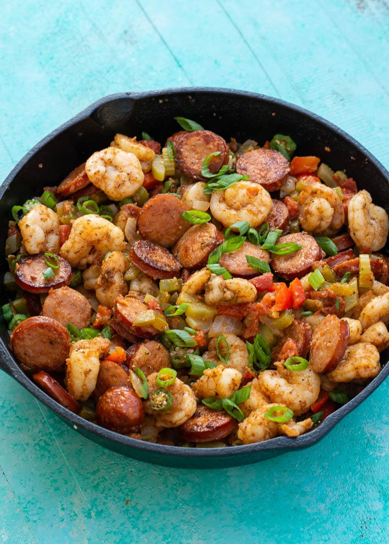 This Creole Shrimp and Sausage Skillet is the perfect 20 minute dinner recipe! This dish is packed with smoked sausage, tender shrimp, and vegetables in a buttery cajun sauce!