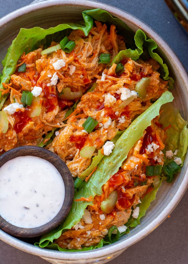 This Crockpot Buffalo Chicken is going to become one of your favorites for keto meal prep! This chicken recipe is easy, delicious and under 2 net carbs!