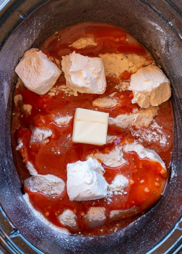 This Crockpot Buffalo Chicken is going to become one of your favorites for keto meal prep! This chicken recipe is easy, delicious and under 2 net carbs!