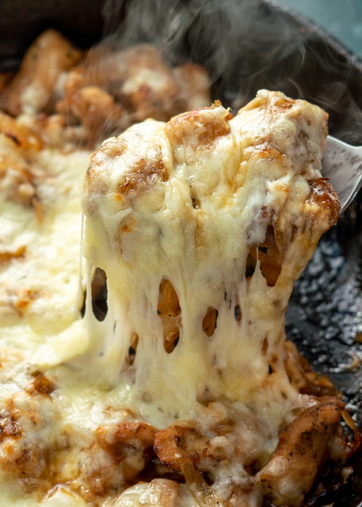 This easy French Onion Chicken has the rich, deep flavor you find in French Onion Soup but in an easy skillet meal! Herb crusted chicken is pan seared and simmered in a caramelized onion sauce and smothered with creamy Gruyere! 