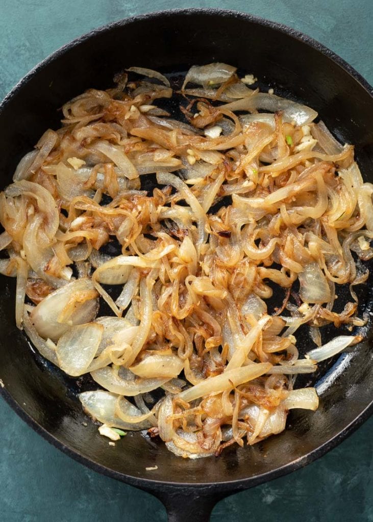 This easy French Onion Chicken has the rich, deep flavor you find in French Onion Soup but in an easy skillet meal! Herb crusted chicken is pan seared and simmered in a caramelized onion sauce and smothered with creamy Gruyere! 