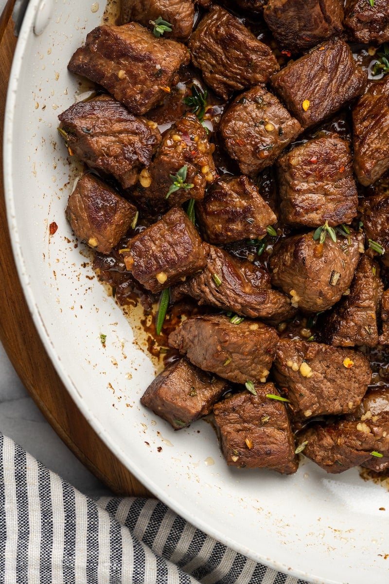 These easy Garlic Butter Steak Bites are cooked in a sauce with fresh herbs, chili flakes, and garlic. This steak recipe is naturally low-carb, requires one pan, and takes just 15 minutes to make.