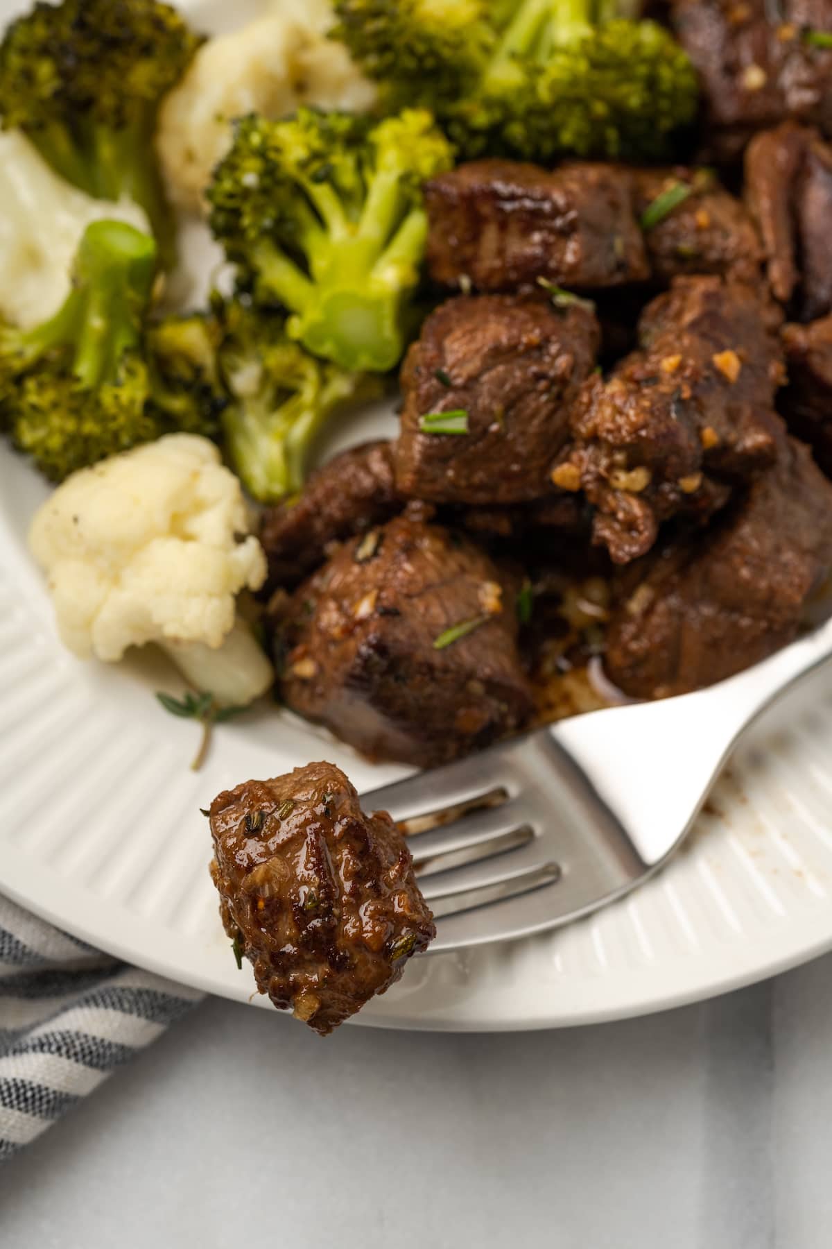 These easy Garlic Butter Steak Bites are cooked in a sauce with fresh herbs, chili flakes, and garlic. This steak recipe is naturally low-carb, requires one pan, and takes just 15 minutes to make.