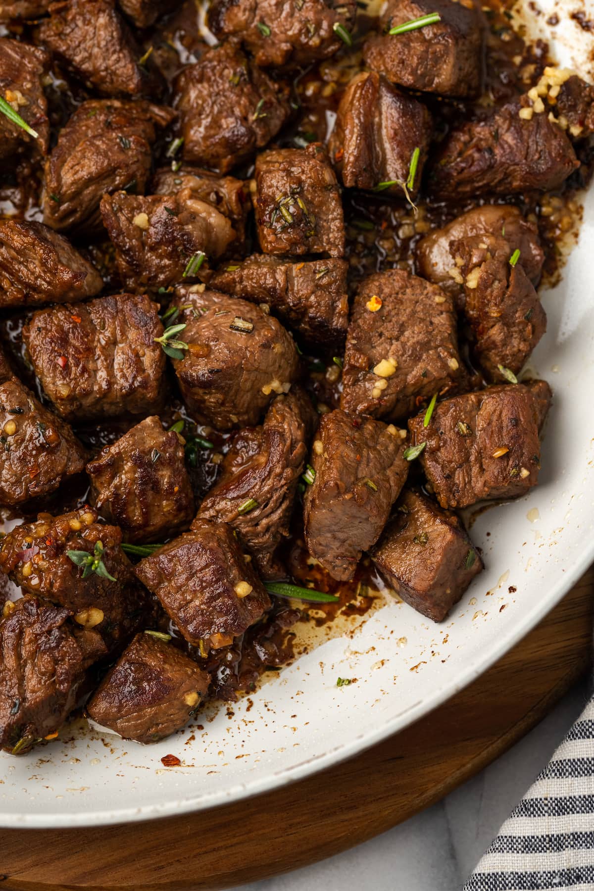 These easy Garlic Butter Steak Bites are cooked in a sauce with fresh herbs, chili flakes, and garlic. This steak recipe is naturally low-carb, requires one pan, and takes just 15 minutes to make.