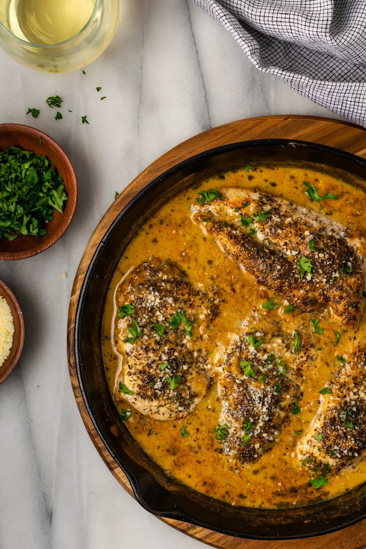 This garlic parmesan chicken recipe is rich, creamy, and loaded with garlic. It’s a decadent keto-friendly dinner that you can make at home in about 20 minutes.