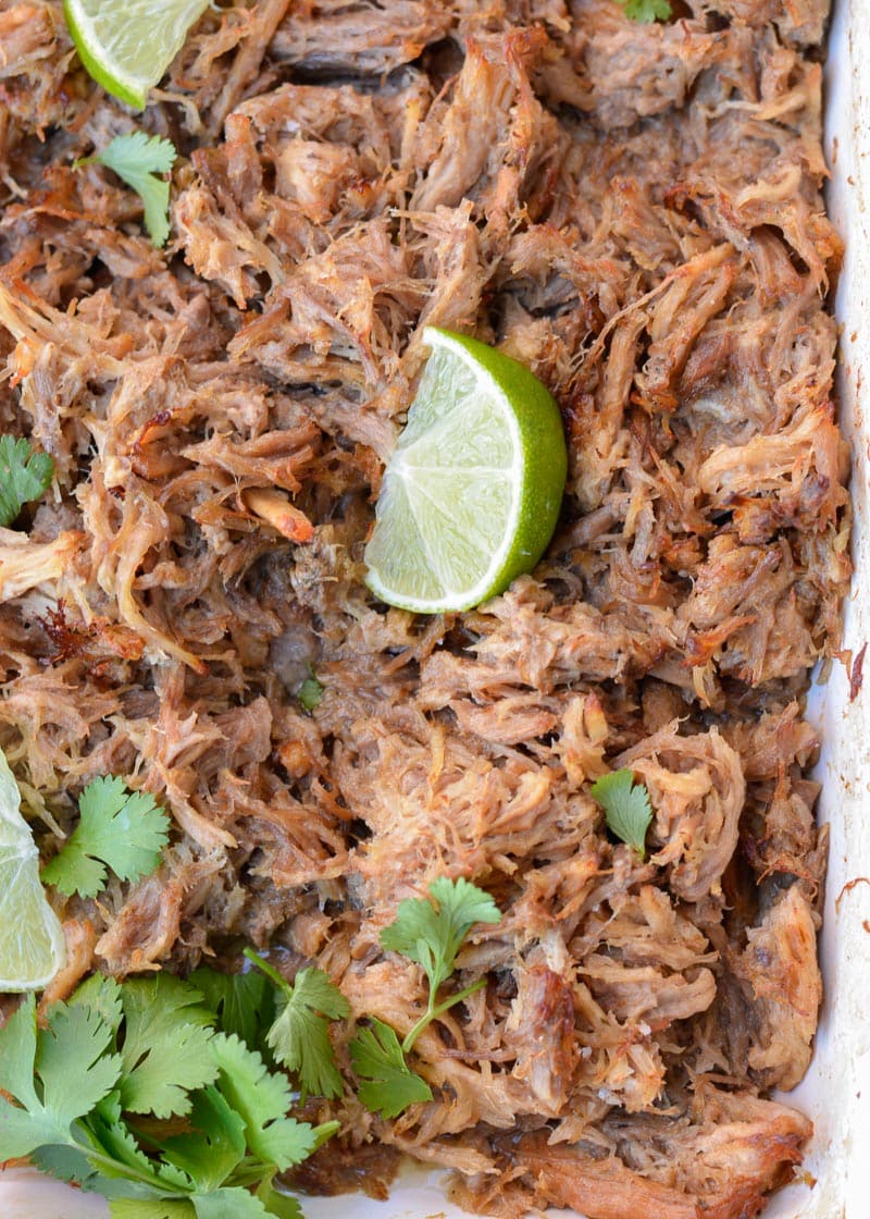 These delicious Instant Pot Carnitas are keto-friendly and easy to make! You can enjoy two street tacos served with a spicy keto slaw for fewer than 5 net carbs, making it the perfect low-carb dinner recipe!