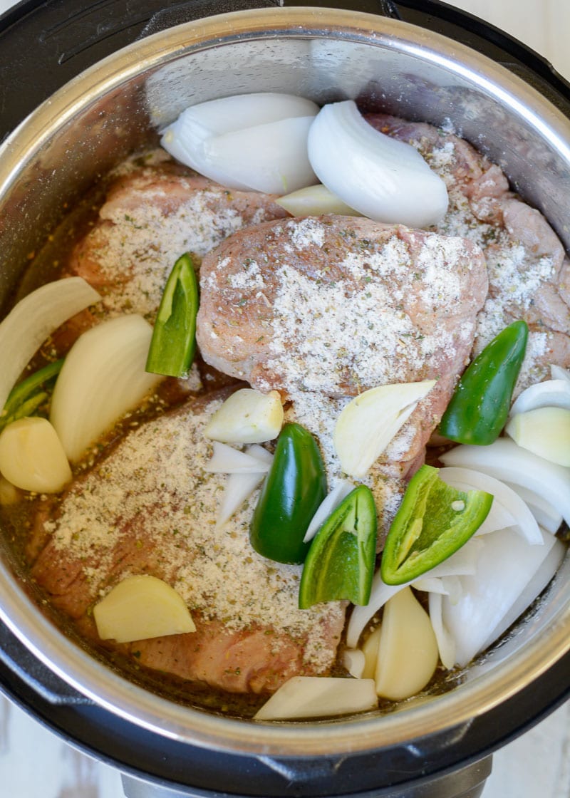 These delicious Instant Pot Carnitas are keto-friendly and easy to make! You can enjoy two street tacos served with a spicy keto slaw for fewer than 5 net carbs, making it the perfect low-carb dinner recipe!