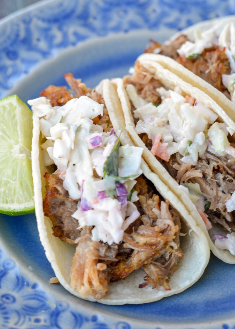 These delicious Instant Pot Carnitas are keto-friendly and easy to make! You can enjoy two street tacos served with a spicy keto slaw for fewer than 5 net carbs, making it the perfect low-carb dinner recipe!