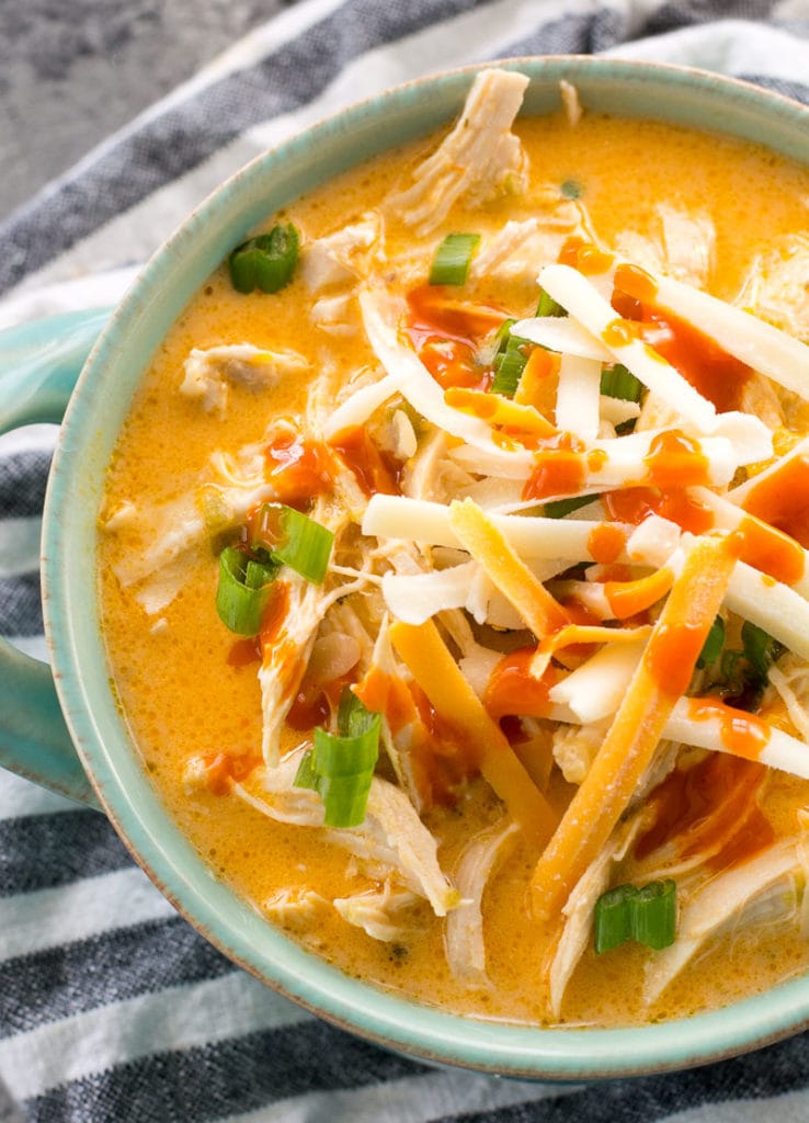 This low carb Instant Pot Buffalo Chicken Soup is loaded with tender shredded chicken, spicy buffalo sauce and tons of cheese! Under 5 net carbs per serving and perfect for keto meal prep! #keto