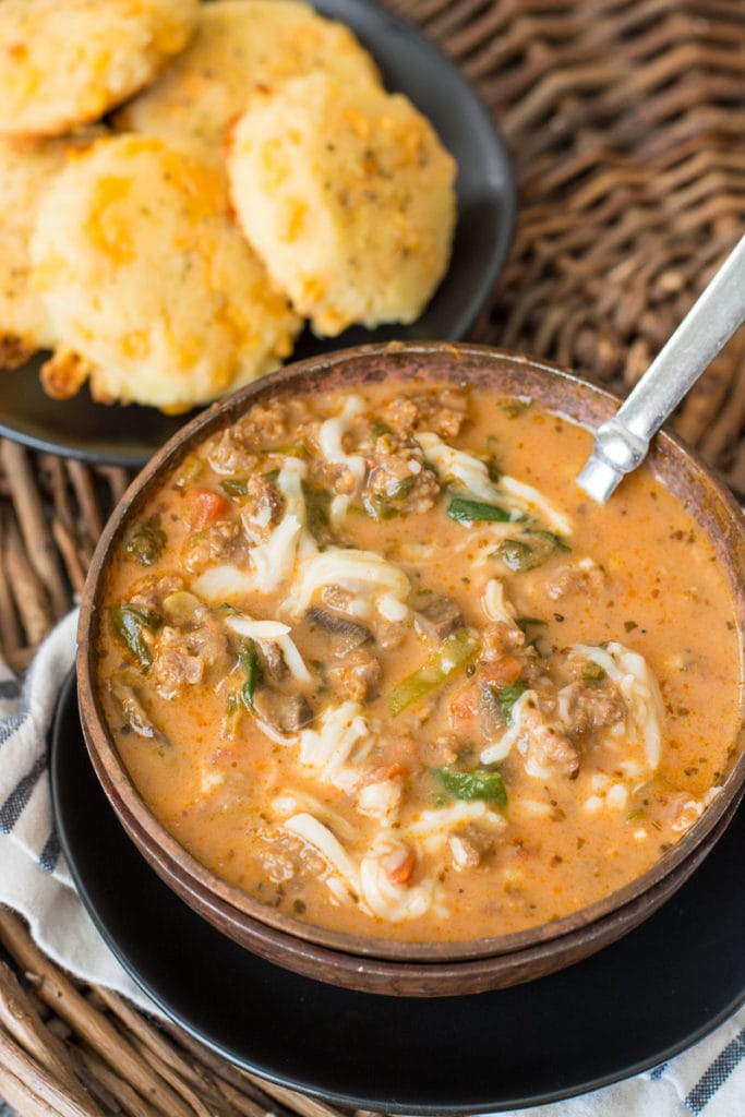 This easy Instant Pot Pizza Soup is loaded with meat and vegetables in an ultra creamy broth! At about 7 net carbs per serving this is a low carb soup you'll enjoy all winter long!