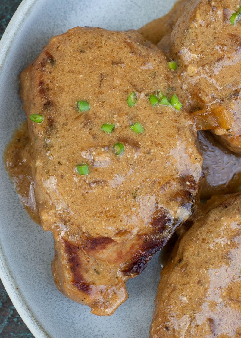 These easy Instant Pot Pork Chops require just 6 minutes of cook time! Seasoned and seared pork chops are perfectly tender and served with a savory gravy. This is a low carb meal your entire family will love!