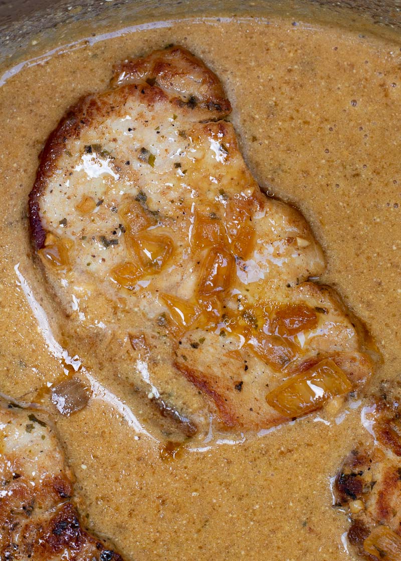 These easy Instant Pot Pork Chops require just 6 minutes of cook time! Seasoned and seared pork chops are perfectly tender and served with a savory gravy. This is a low carb meal your entire family will love!