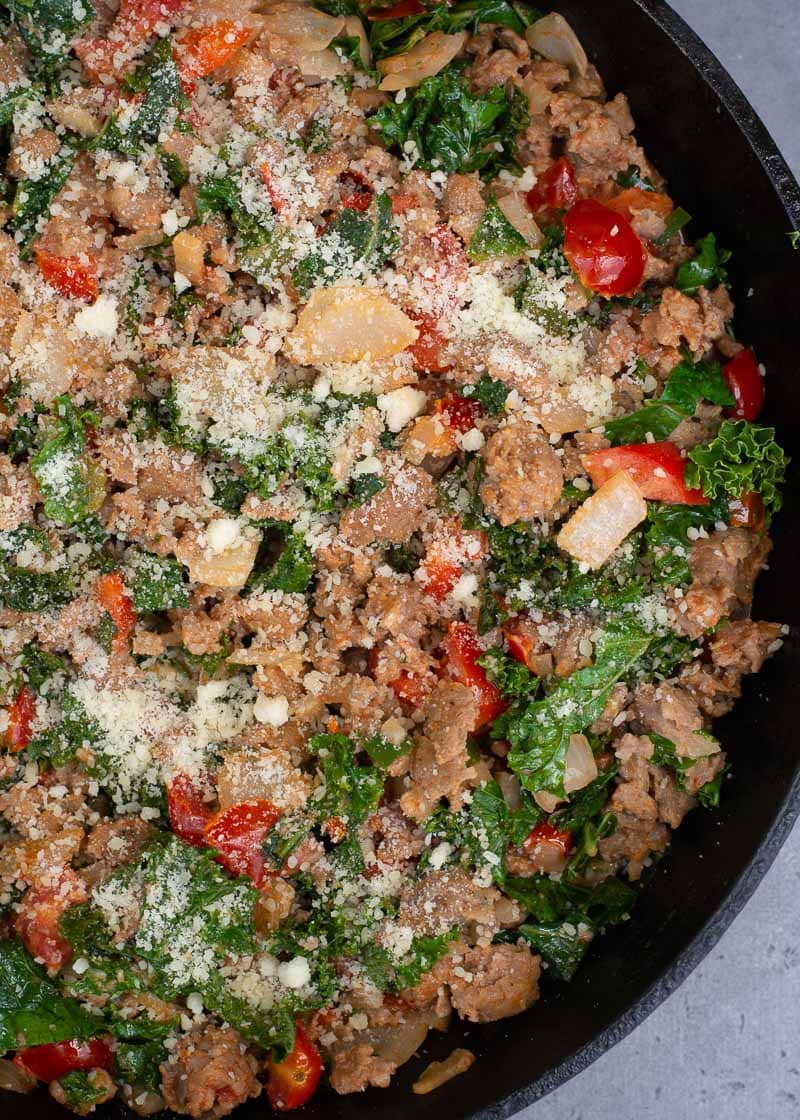 This simple Italian Sausage and Kale skillet is a hearty one pan meal loaded with meat and vegetables! Enjoy a generous helping for just 6 net carbs!