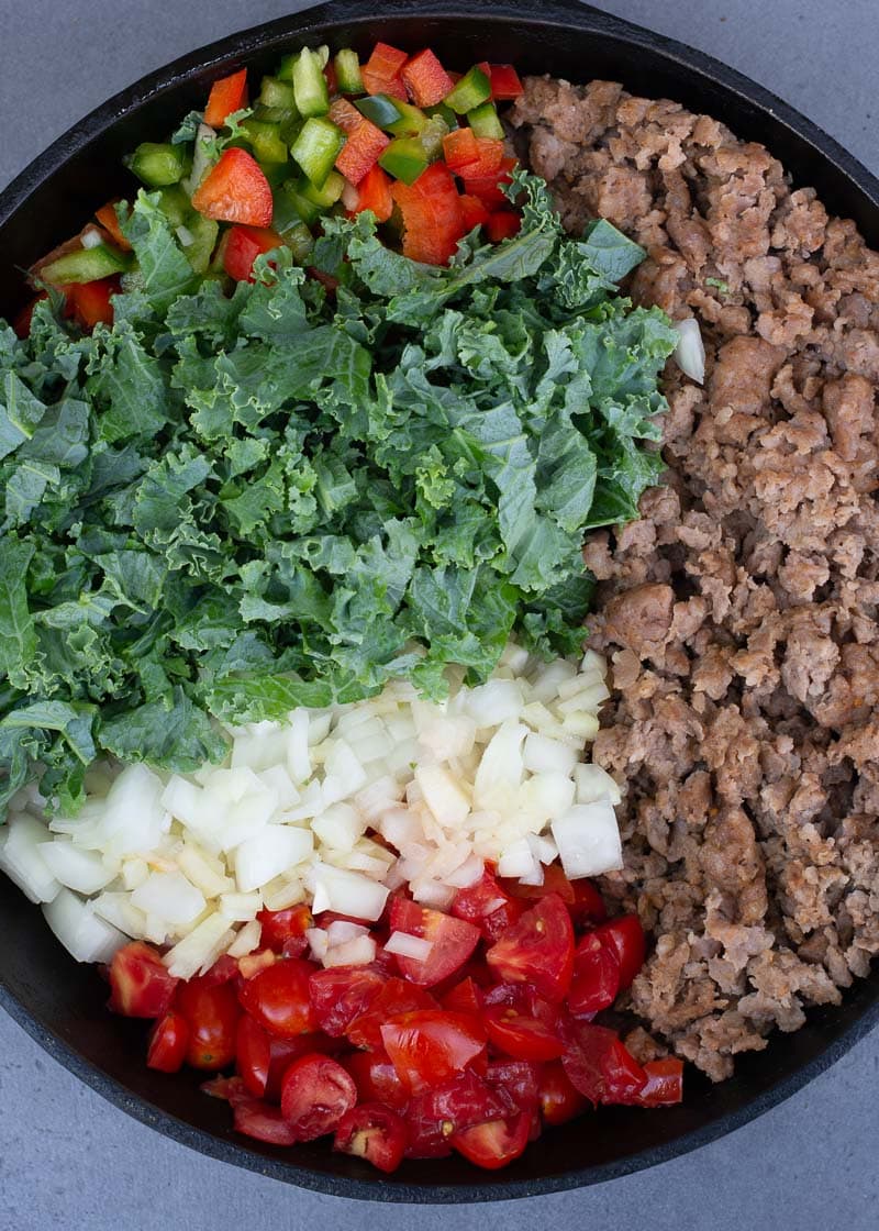 This simple Italian Sausage and Kale skillet is a hearty one pan meal loaded with meat and vegetables! Enjoy a generous helping for just 6 net carbs!