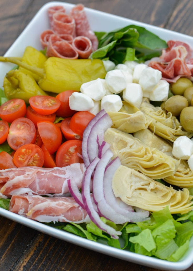 This Keto Antipasto Salad is the perfect no-cook lunch or dinner option! Under 6 net carbs for a large, packed salad with a tasty low-carb lemon vinaigrette!