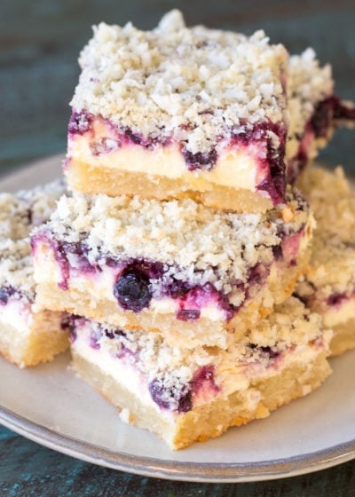 These Keto Blueberry Lemon Cheesecake bars are the ultimate four layer keto dessert! At about 5.5 net carbs per bar you won't believe how decadent these are!