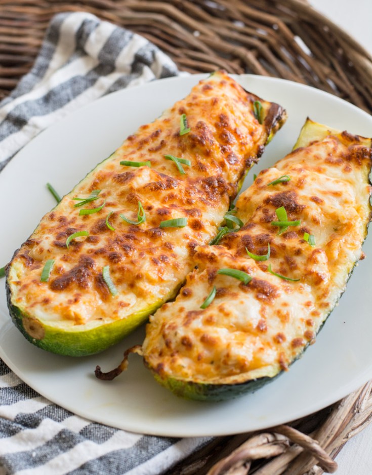 These easy Buffalo Chicken Zucchini Boats are loaded with chicken, cheese and spicy buffalo sauce! At only 4 net carbs per serving this will be your new favorite keto dinner!