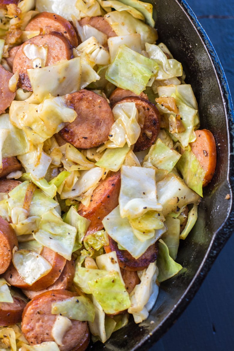 Need an easy low carb, one pan dinner? I've got you covered! This Keto Sausage and Cabbage Skillet is ready in under 20 minutes and has less than 6 carbs per serving! #keto #onepan