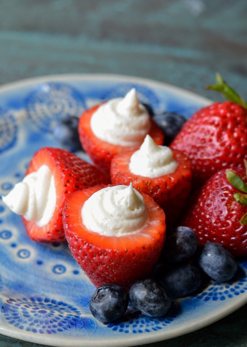 Simple no bake Keto Cheesecake Strawberries are the easiest low carb dessert! Enjoy four stuffed strawberries for about 5 net carbs! 