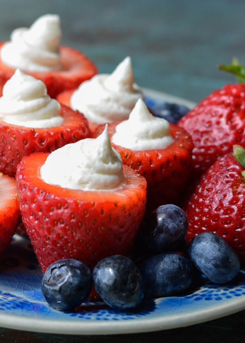 Simple no bake Keto Cheesecake Strawberries are the easiest low carb dessert! Enjoy four stuffed strawberries for about 5 net carbs! 