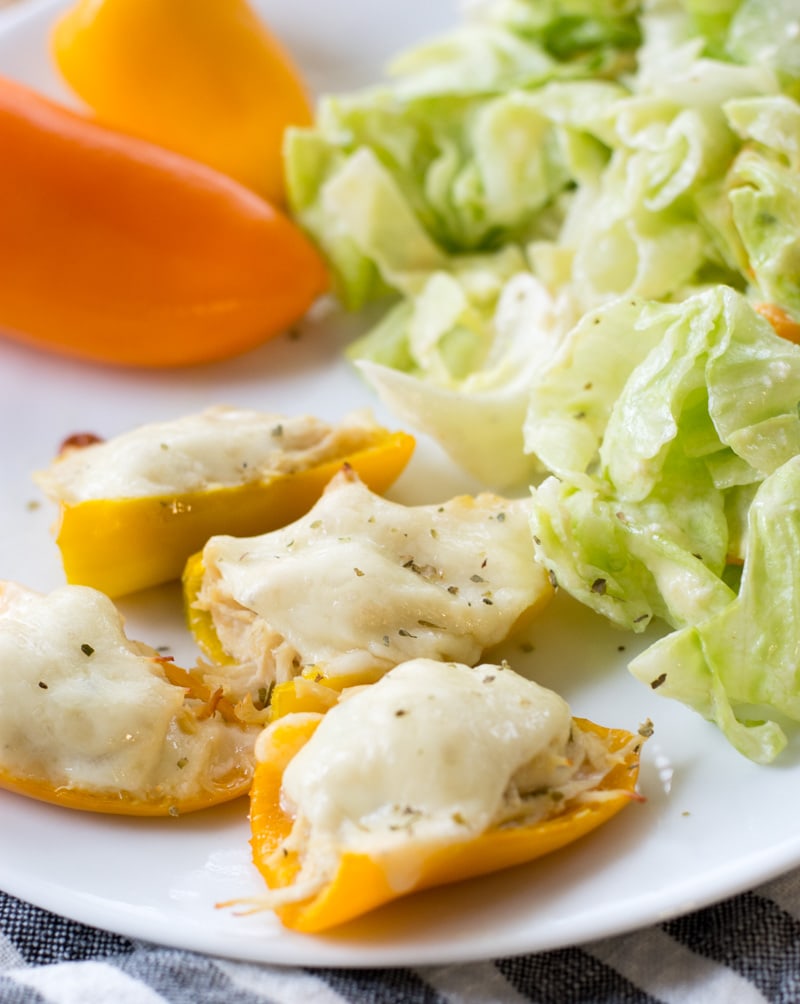 These easy Keto Cheesy Chicken Stuffed Peppers are about one net carb each! A great low carb, healthy dinner or snack! #keto