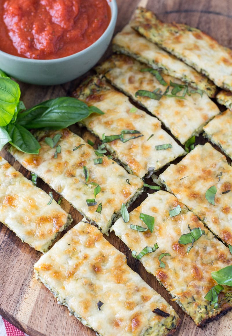 Try these Keto Cheesy Zucchini Breadsticks for a low carb appetizer or light lunch! At just 1.9 net carbs per breadstick this is a great low carb game day snack! #keto