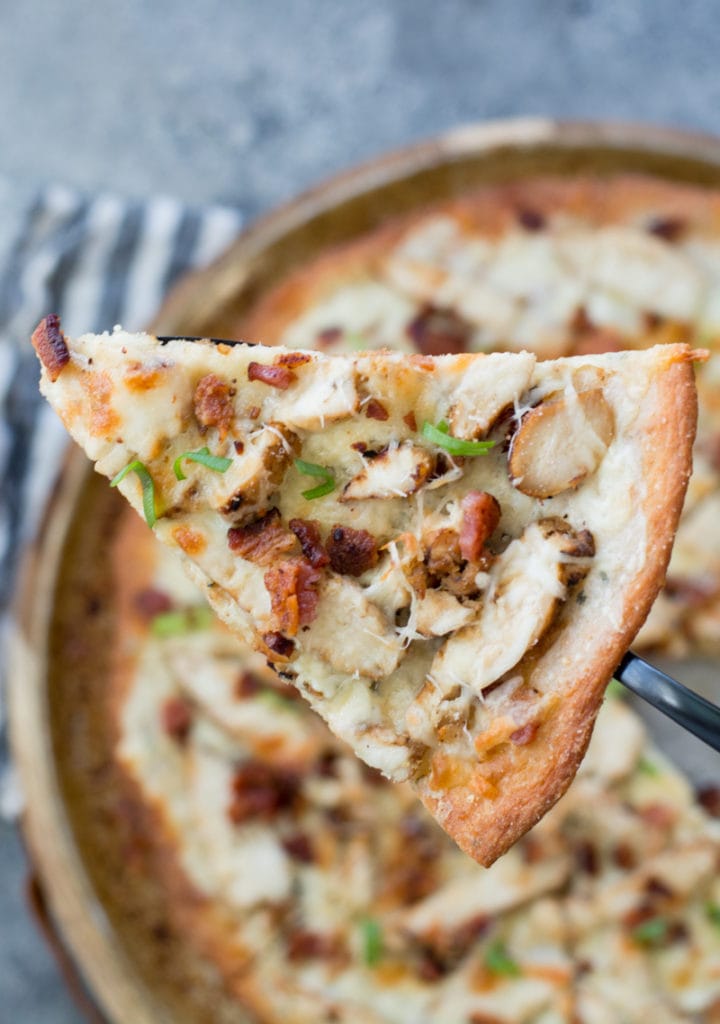 This homemade Chicken Bacon Ranch Pizza is loaded with grilled chicken, crispy bacon, a creamy ranch pizza sauce, and a perfectly crispy low carb crust! Only 3 net carbs per slice!