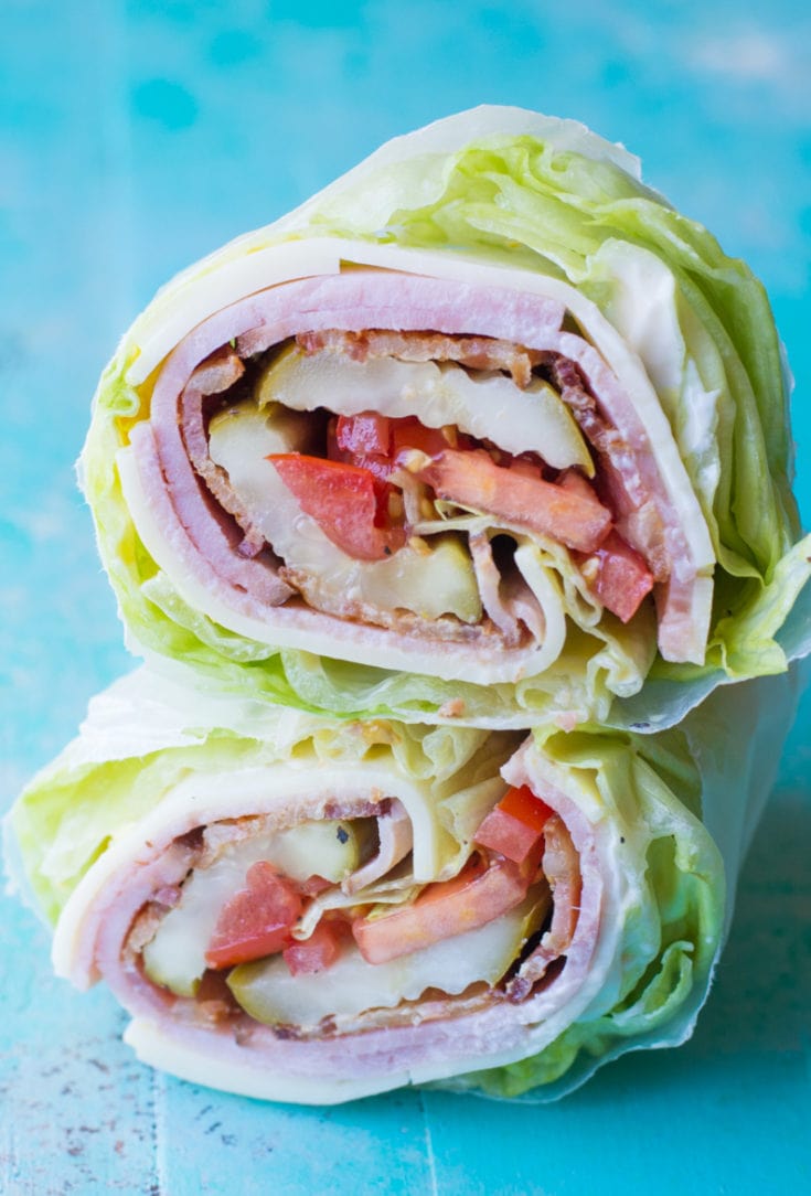 Looking for a new keto lunch? This Keto Club Lettuce Wrap is packed with thick slices of ham, bacon, cheese, crunchy lettuce and juicy tomatoes! This filling lunch is under 4 net carbs! #keto