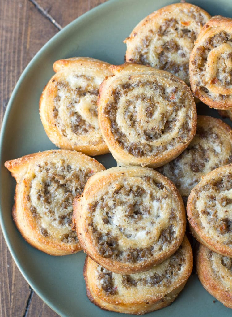 The perfect keto appetizer! Keto Sausage Cream Cheese Pinwheels are made with fat head dough and loaded with sausage and cream cheese! Just two net carbs per serving! #keto