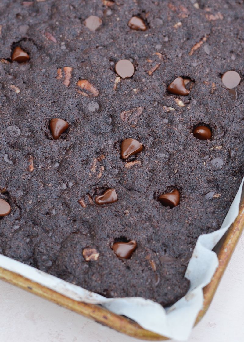 keto double chocolate chip cookie bars in a metal pan. 