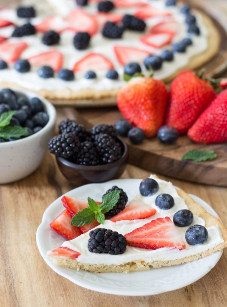 You can enjoy a summer favorite even on Keto! This Keto Fruit Pizza is high in flavor and low in carbs. Perfect for all of your summer cookouts! Only 5.4 net carbs per slice!  #keto