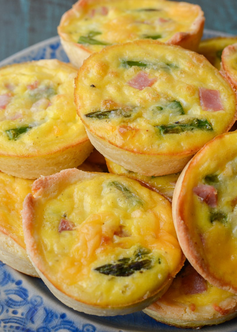 This savory Keto Ham and Cheese Quiche is the perfect low carb brunch recipe! Packed with smoked ham, tender asparagus and sharp cheddar cheese this will be a family favorite! 