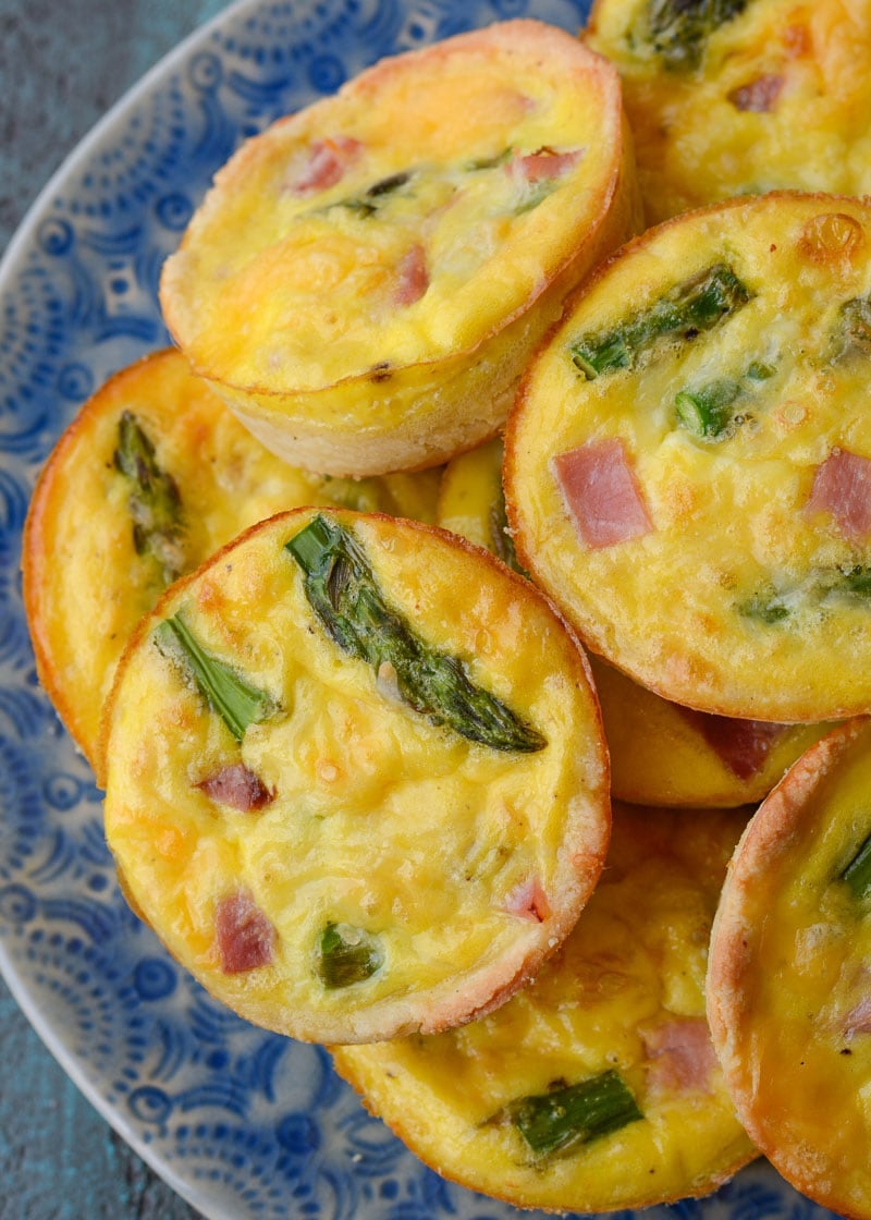 This savory Keto Ham and Cheese Quiche is the perfect low carb brunch recipe! Packed with smoked ham, tender asparagus and sharp cheddar cheese this will be a family favorite! 