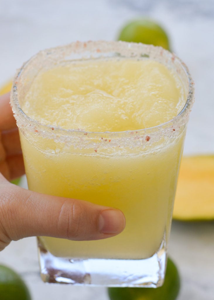 This beautiful Mango Margarita is keto friendly and perfect for a hot summer day! Low carb, low calorie, and no added sugar -- Just 3.4 net carbs!